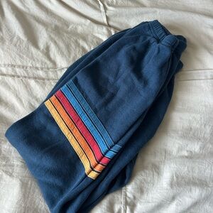 Aviator Nation blue sweatpants with rainbow stripes on leg!!